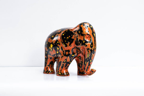 Green Signature Home Décor, a rare sustainable papier mache art deco sculpture- The Welcoming Black and Red Elephant